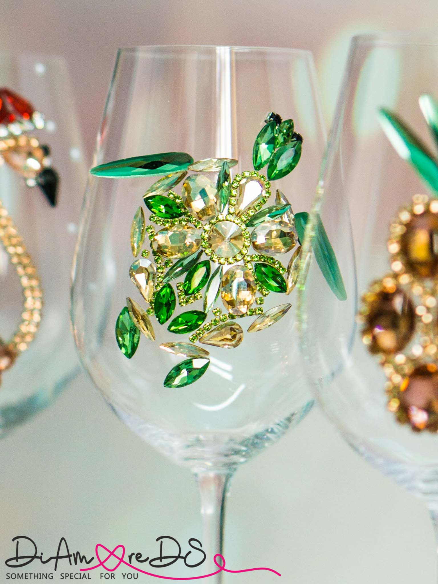 Artisanal wine glass with a sea turtle motif, handcrafted with green and gold crystals for a luxurious feel.