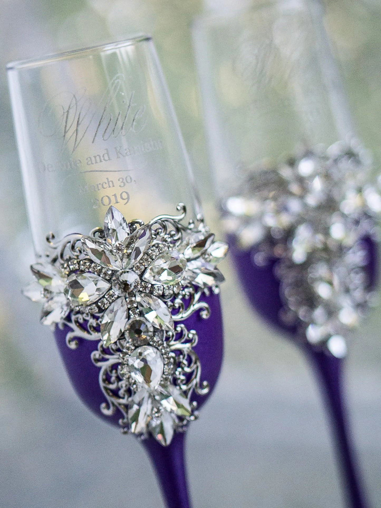 Personalized wedding champagne glasses in plum purple