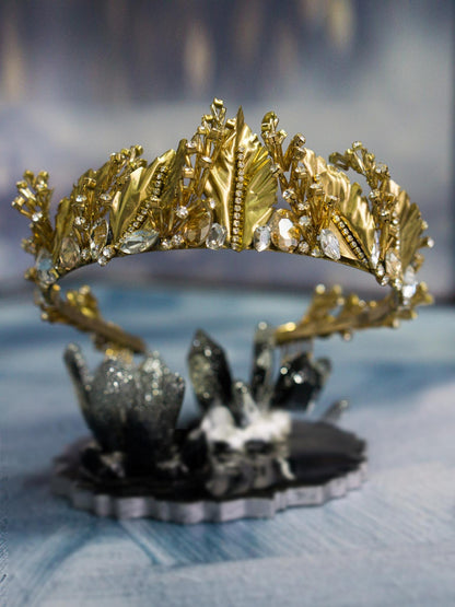 Gold Wedding Crown with Leaves and Crystals displayed on blue background